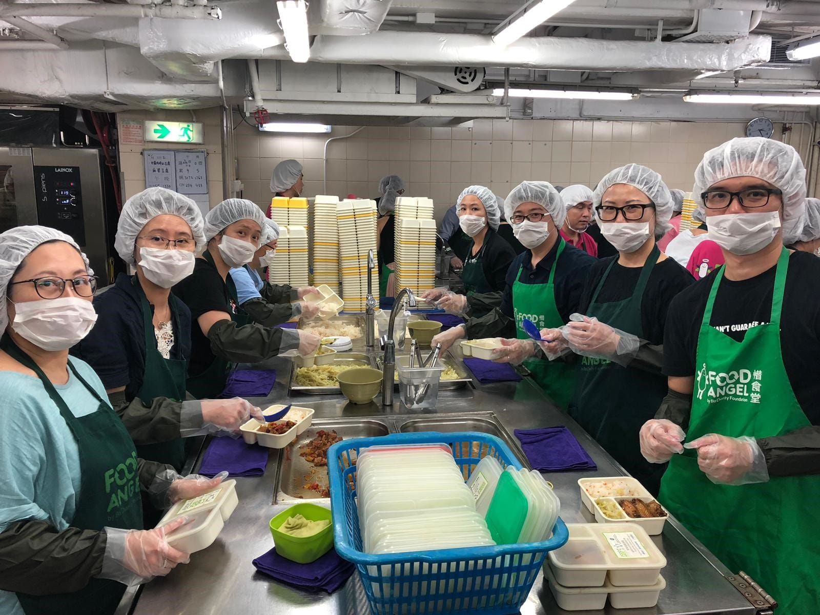 Howden employees volunteering in a kitchen