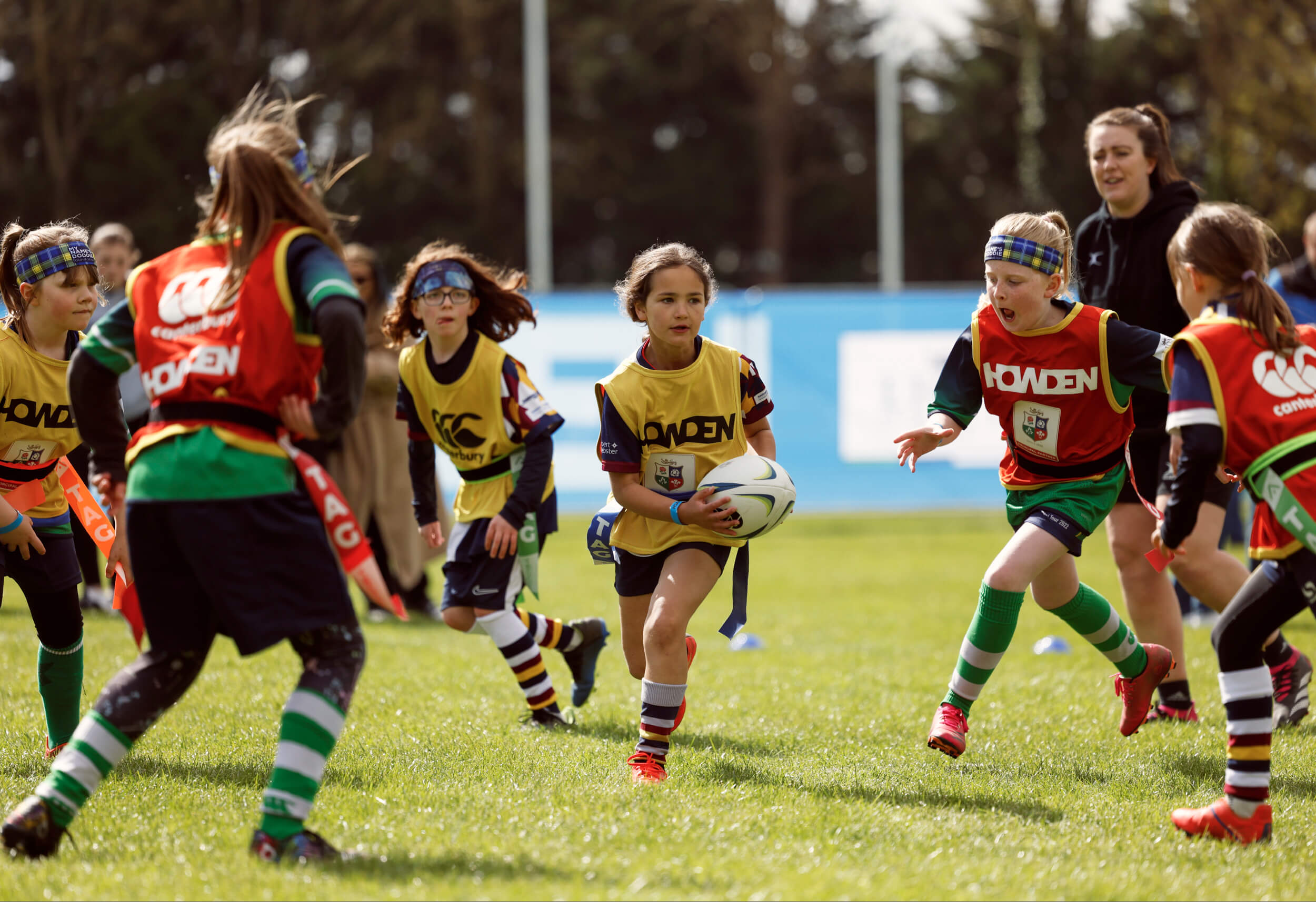 Young girls playing rugby