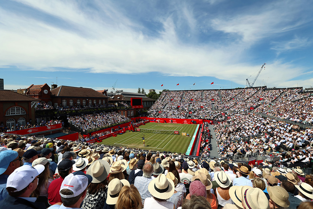 A crowd watching a tennis match