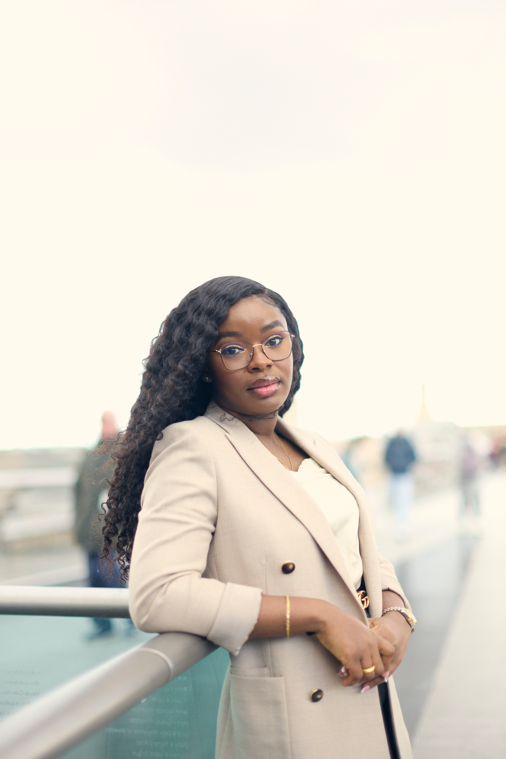 Howden's Chisom Kane leaning against the rail of Millennium Bridge in London