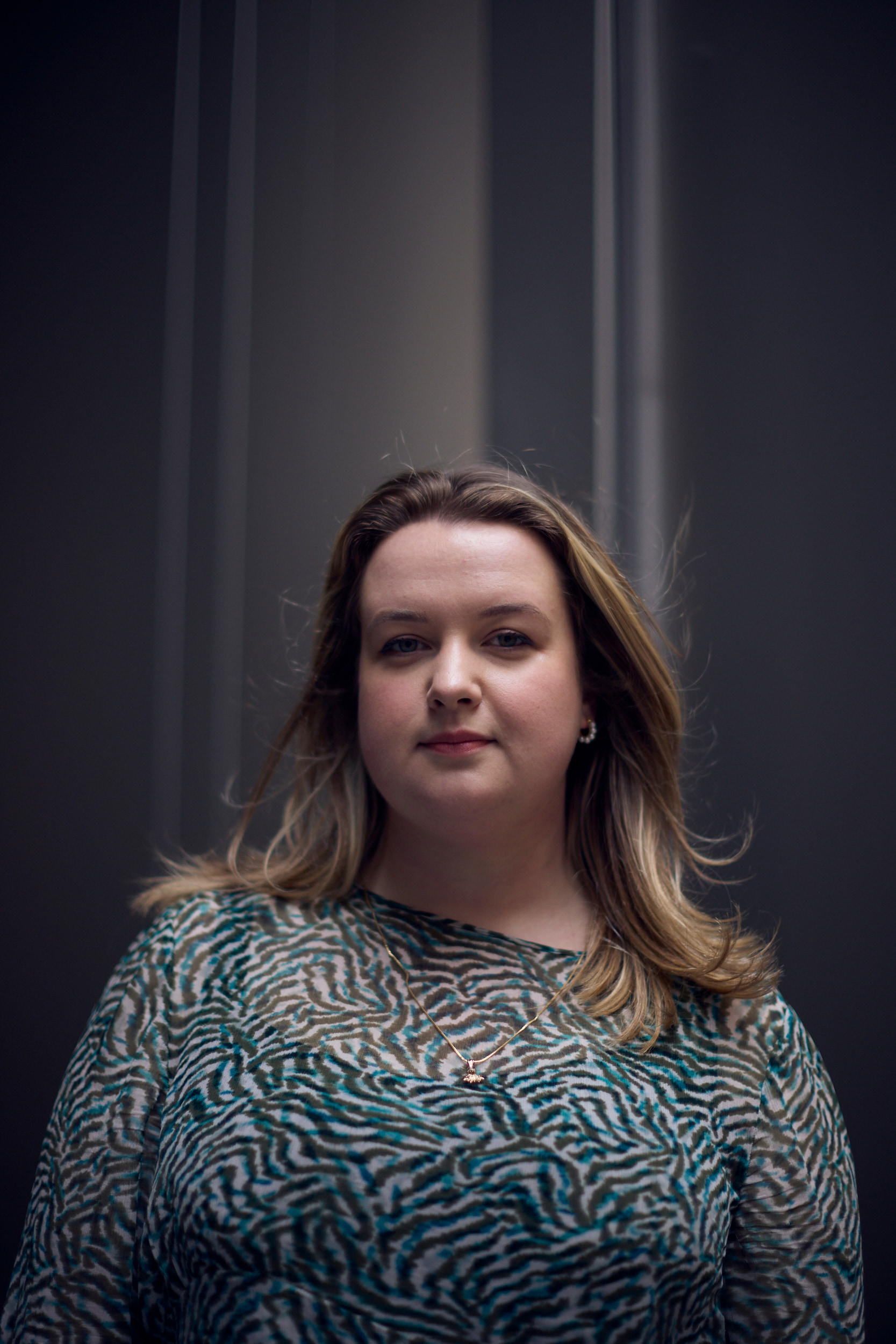 Howden's Naomi Price posing in front of a grey background