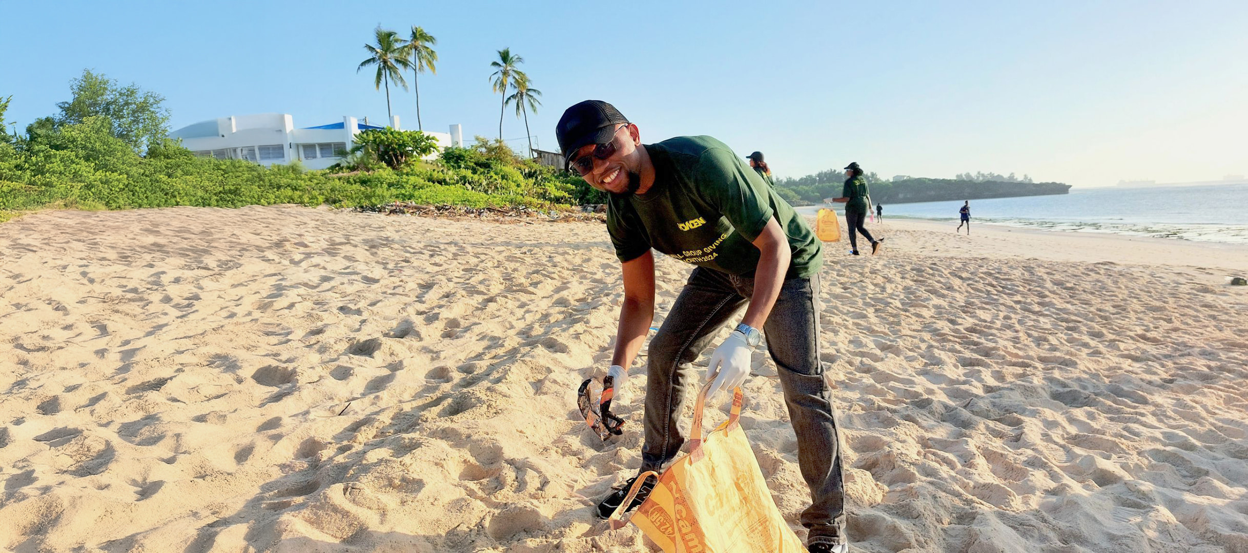 Howden employee volunteering at a beach clean-up