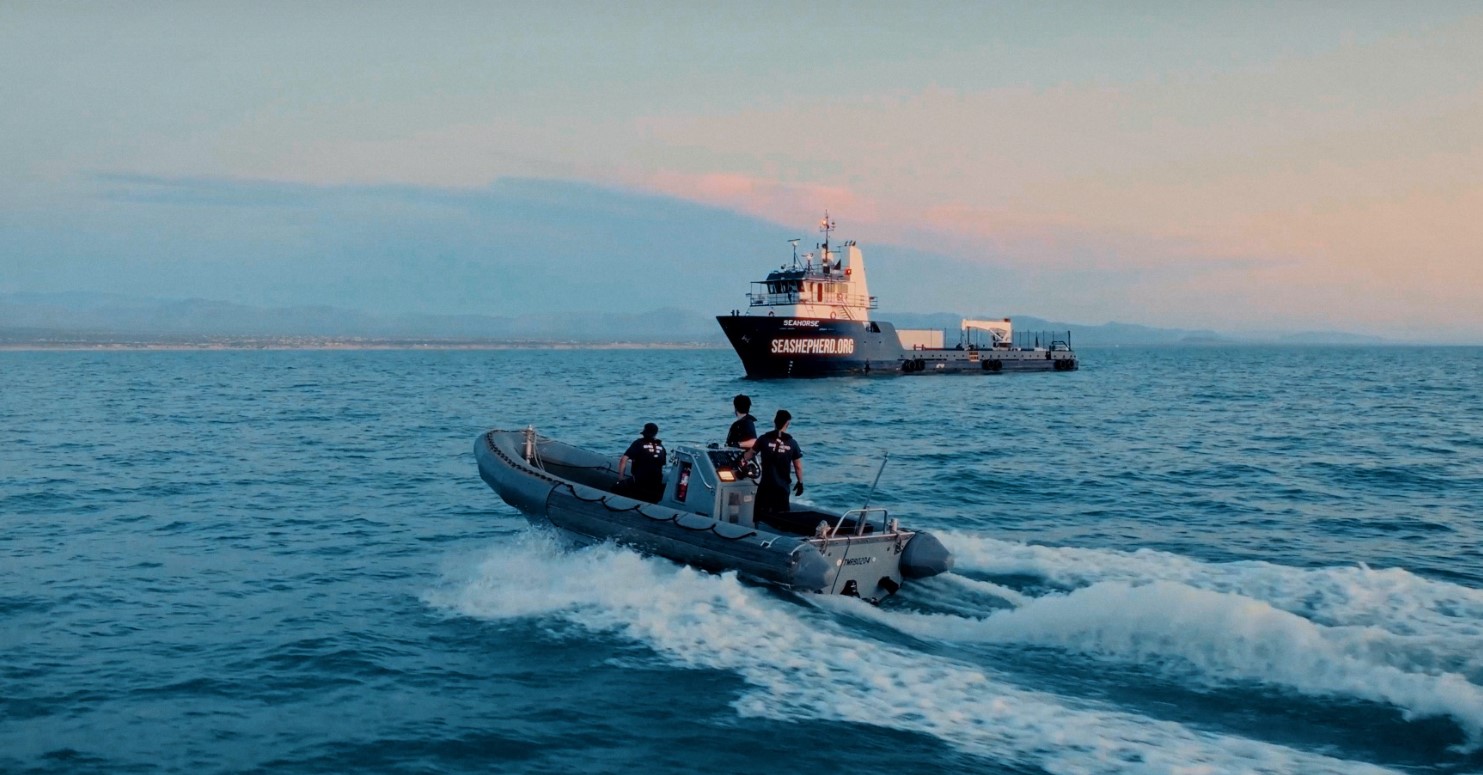 A raft approaching a Sea Shepherd ship at sea